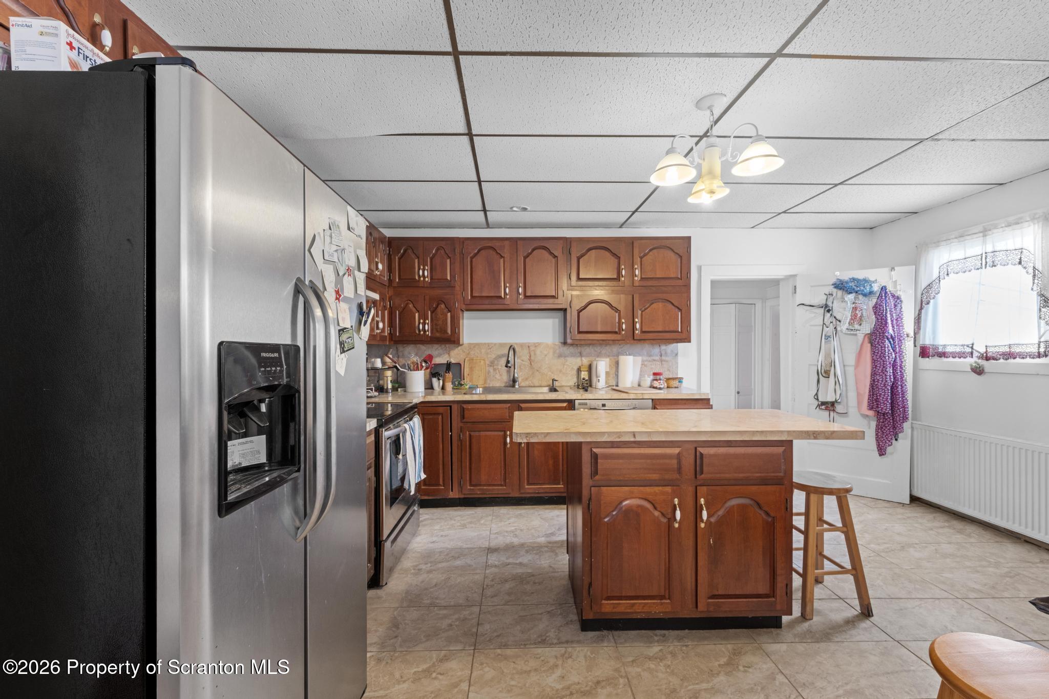 812 Old Street Hazleton, PA 18202 - Photo 5 of 29 a kitchen with stainless steel appliances granite countertop a refrigerator and a stove top oven