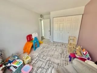 a bed room with a bed and a couch