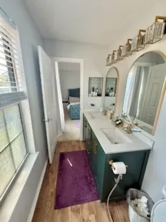 a living room with furniture and a mirror