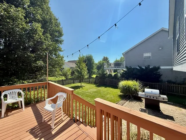 a view of a chairs and tables in the balcony