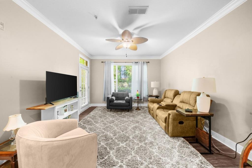 2103 Stratford Commons, Unit 2103 Decatur, GA 30033 - Photo 11 of 32 a living room with furniture and a flat screen tv