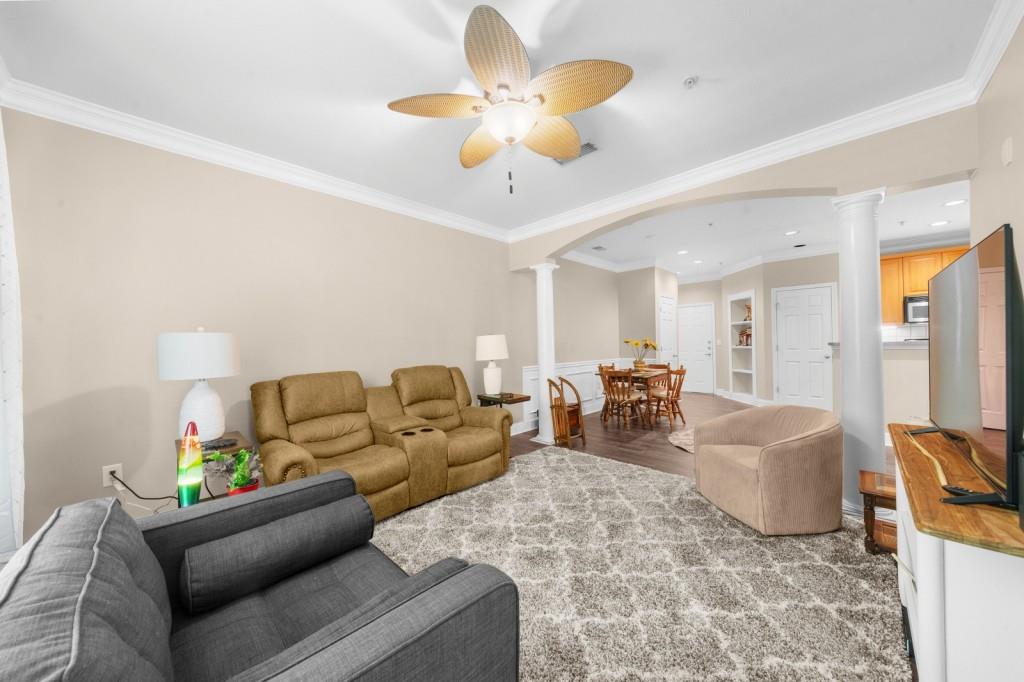 2103 Stratford Commons, Unit 2103 Decatur, GA 30033 - Photo 12 of 32 a living room with furniture and a chandelier