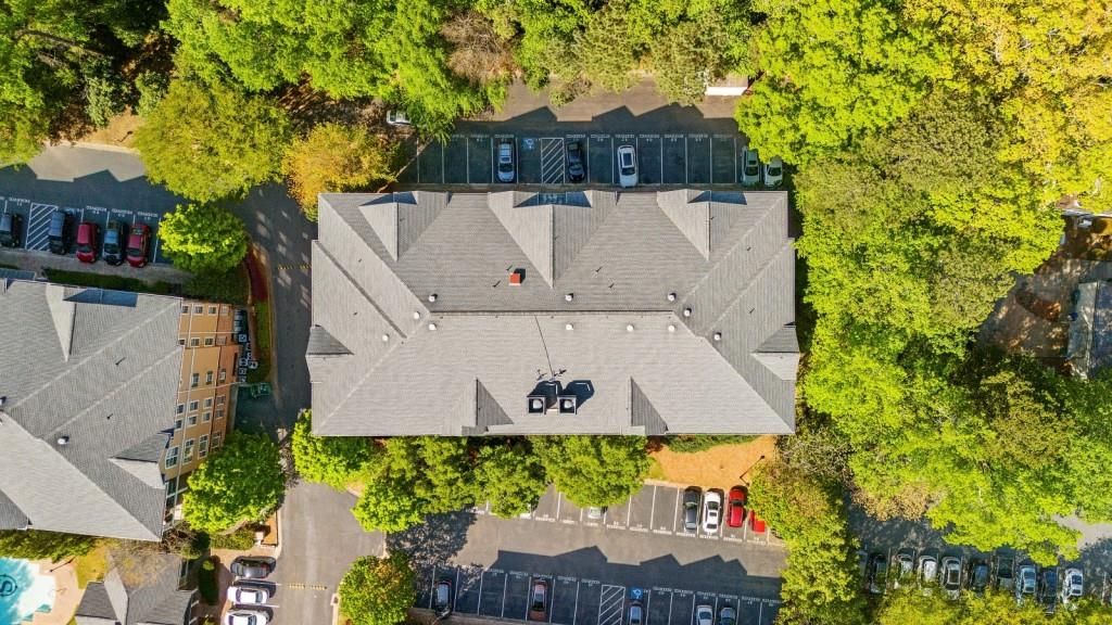 2103 Stratford Commons, Unit 2103 Decatur, GA 30033 - Photo 29 of 32 an aerial view of a house with swimming pool and wooden fence