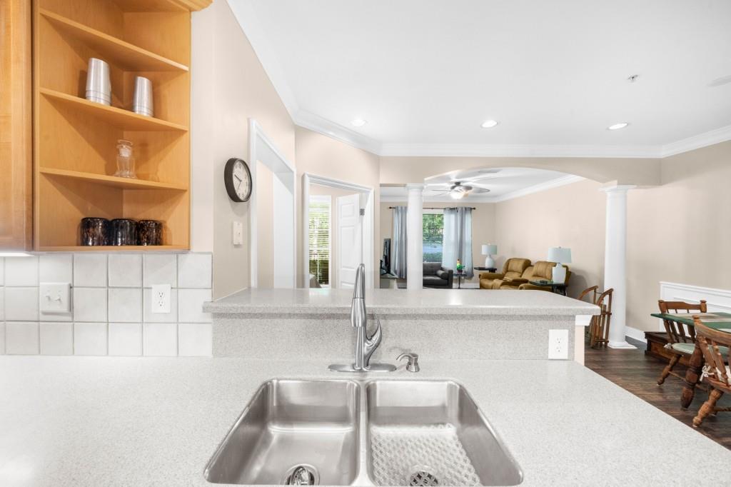 2103 Stratford Commons, Unit 2103 Decatur, GA 30033 - Photo 7 of 32 a kitchen with stainless steel appliances granite countertop a sink and cabinets