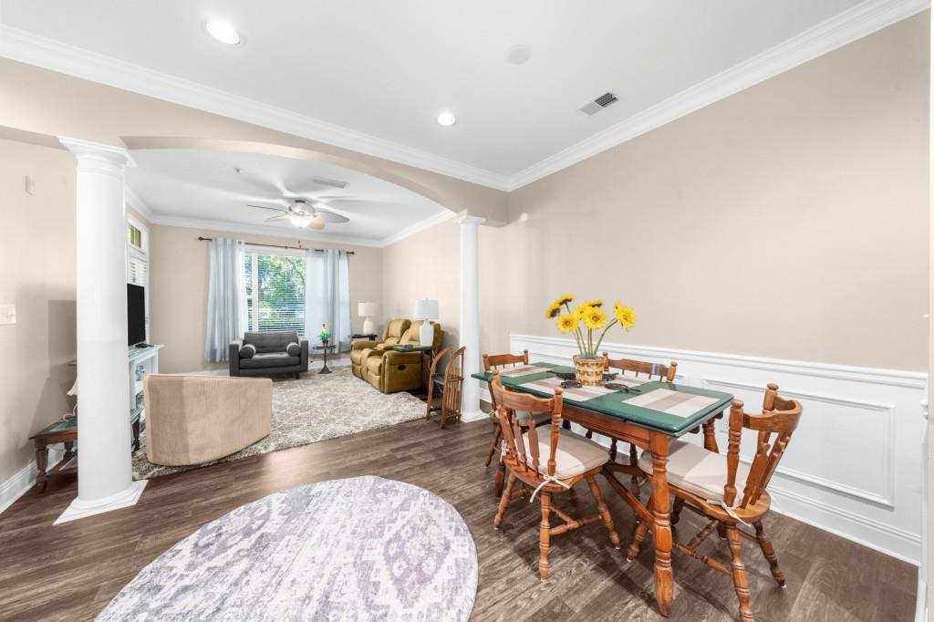 2103 Stratford Commons, Unit 2103 Decatur, GA 30033 - Photo 9 of 32 a living room with furniture and wooden floor