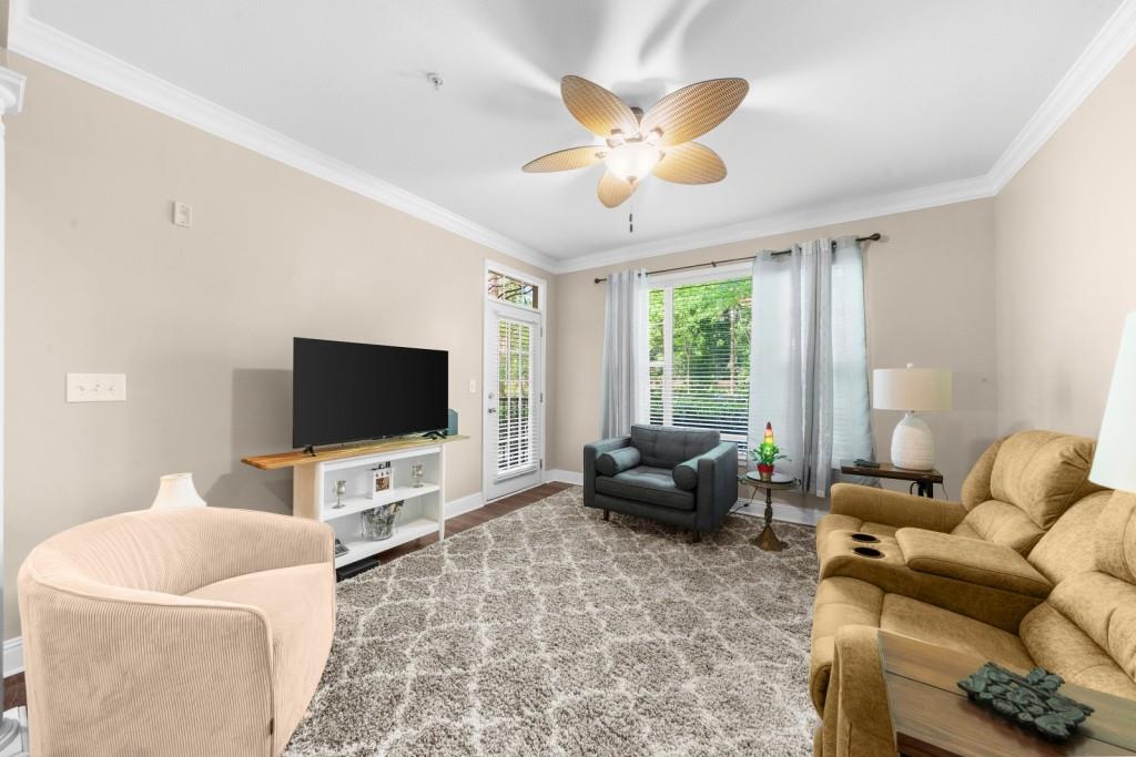 2103 Stratford Commons, Unit 2103 Decatur, GA 30033 - Photo 10 of 32 a living room with furniture and a flat screen tv