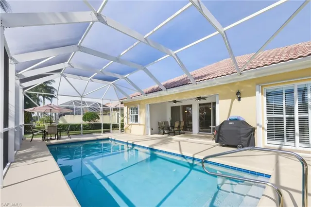 a view of a swimming pool with a patio