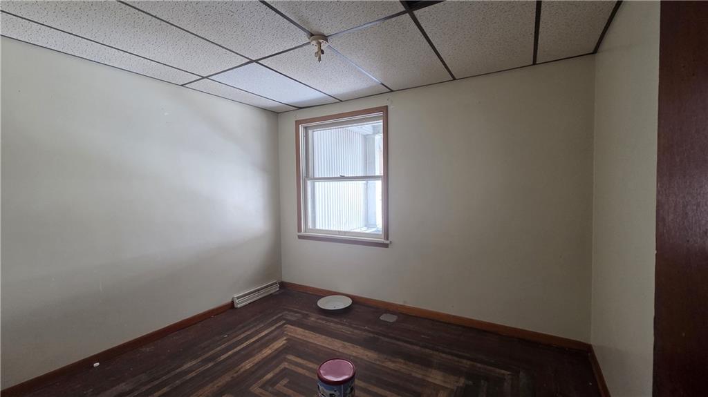 122 Hamilton Avenue Vandergrift, PA 15690 - Photo 12 of 13 a view of room with window and wooden floor
