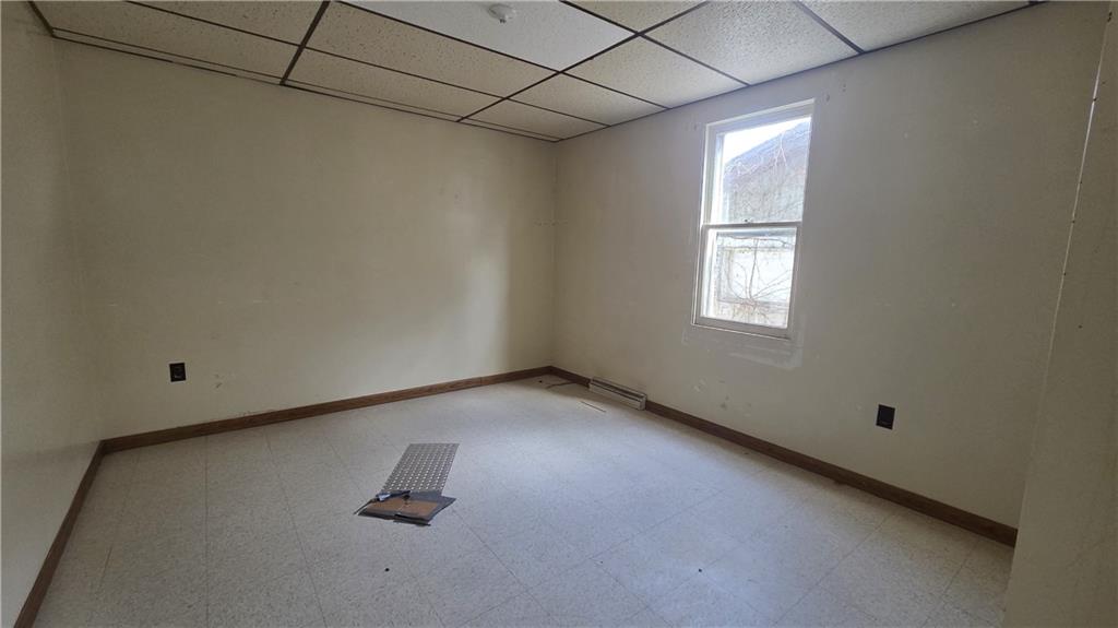 122 Hamilton Avenue Vandergrift, PA 15690 - Photo 9 of 13 an empty room with windows