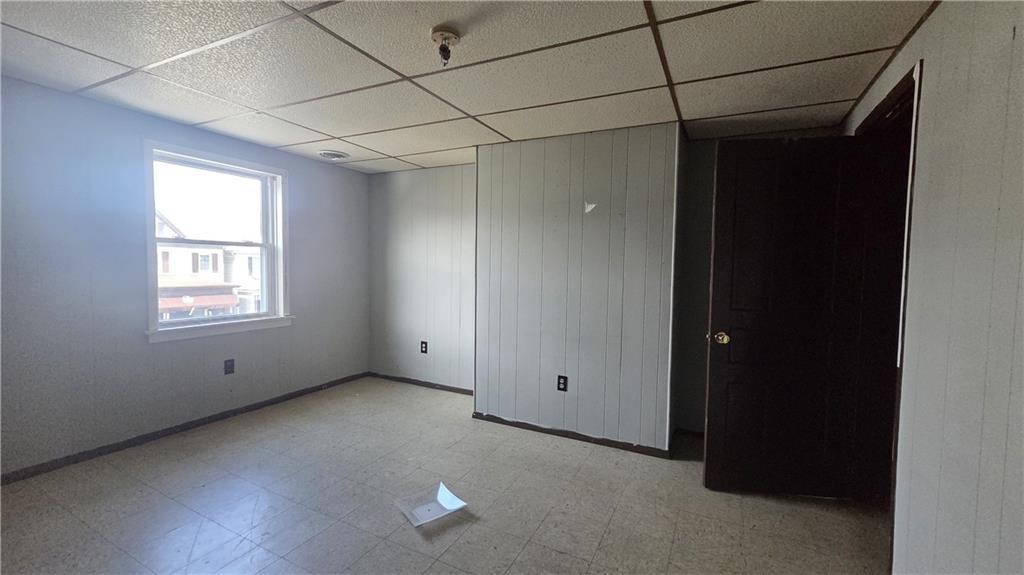 122 Hamilton Avenue Vandergrift, PA 15690 - Photo 10 of 13 a view of empty room with windows