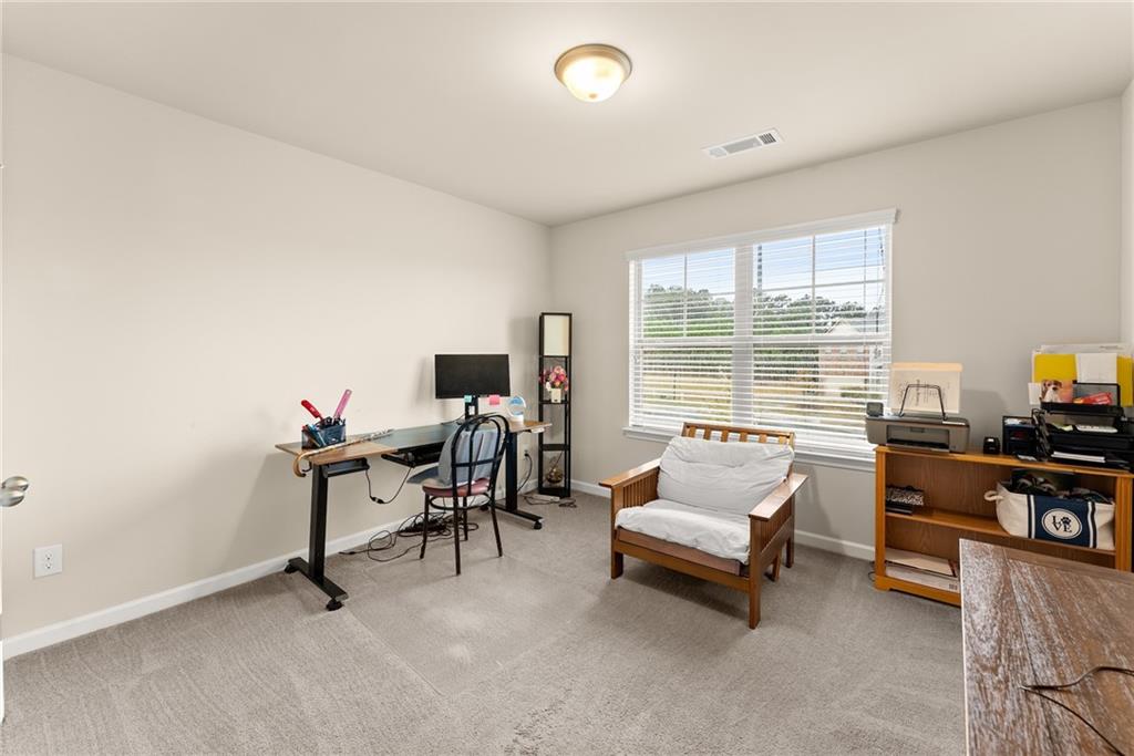 3914 Prospect Point Drive Oakwood, GA 30566 - Photo 21 of 30 a room with furniture and a flat screen tv