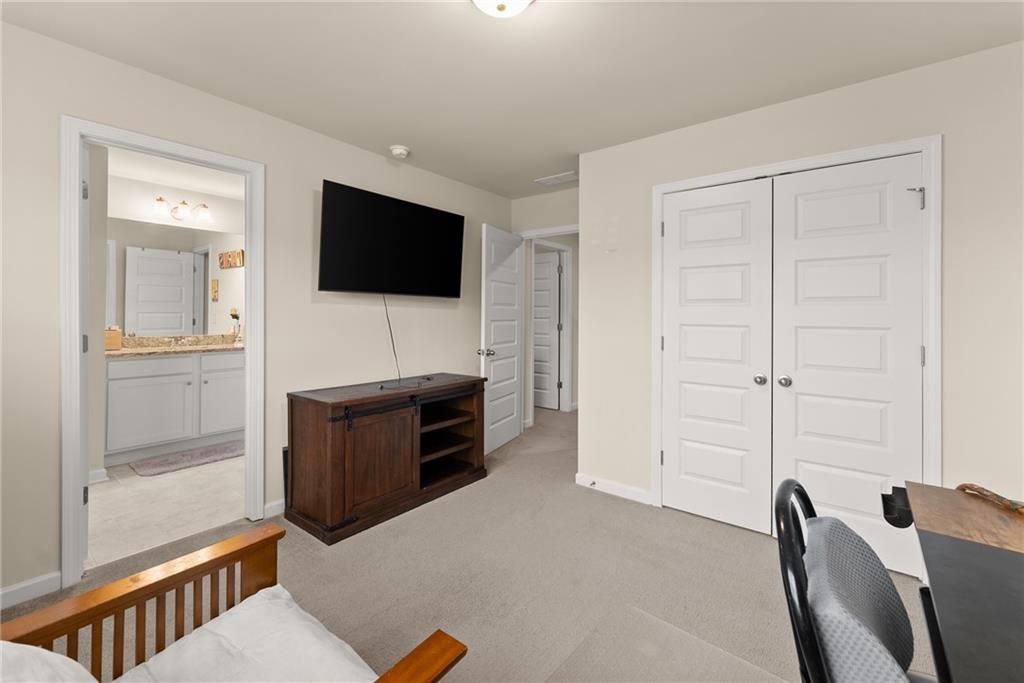 3914 Prospect Point Drive Oakwood, GA 30566 - Photo 22 of 30 a living room with furniture and a flat screen tv