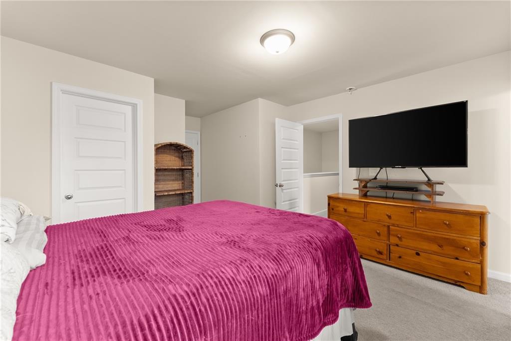 3914 Prospect Point Drive Oakwood, GA 30566 - Photo 25 of 30 a bedroom with a bed and a flat screen tv
