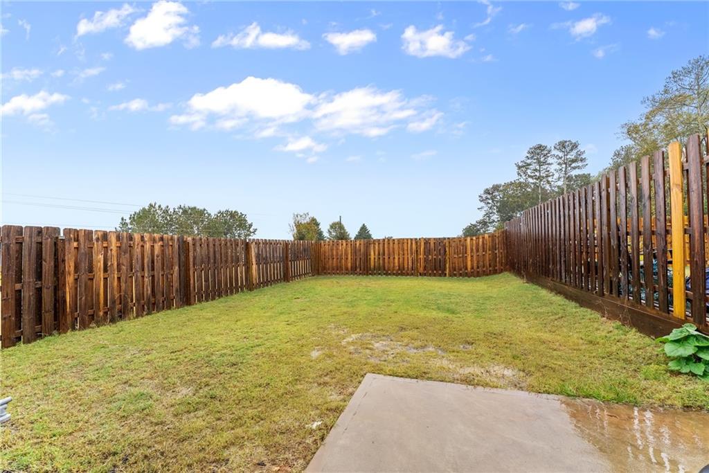 3914 Prospect Point Drive Oakwood, GA 30566 - Photo 27 of 30 a view of a backyard with wooden fence