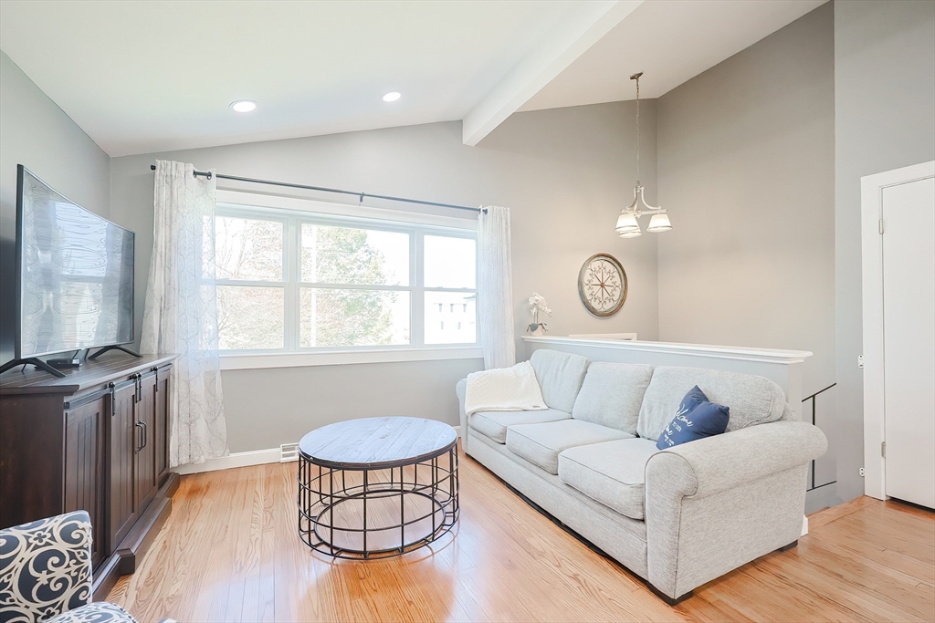 32 Anchorage Road Franklin, MA 02038 - Photo 11 of 32 a living room with furniture and a flat screen tv