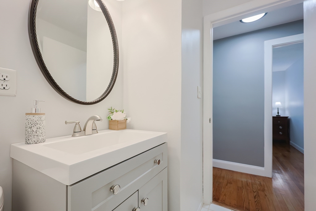 32 Anchorage Road Franklin, MA 02038 - Photo 17 of 32 a bathroom with a sink and a mirror