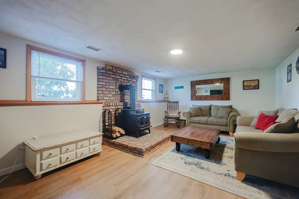 32 Anchorage Road Franklin, MA 02038 - Photo 20 of 32 a living room with furniture and a wooden floor
