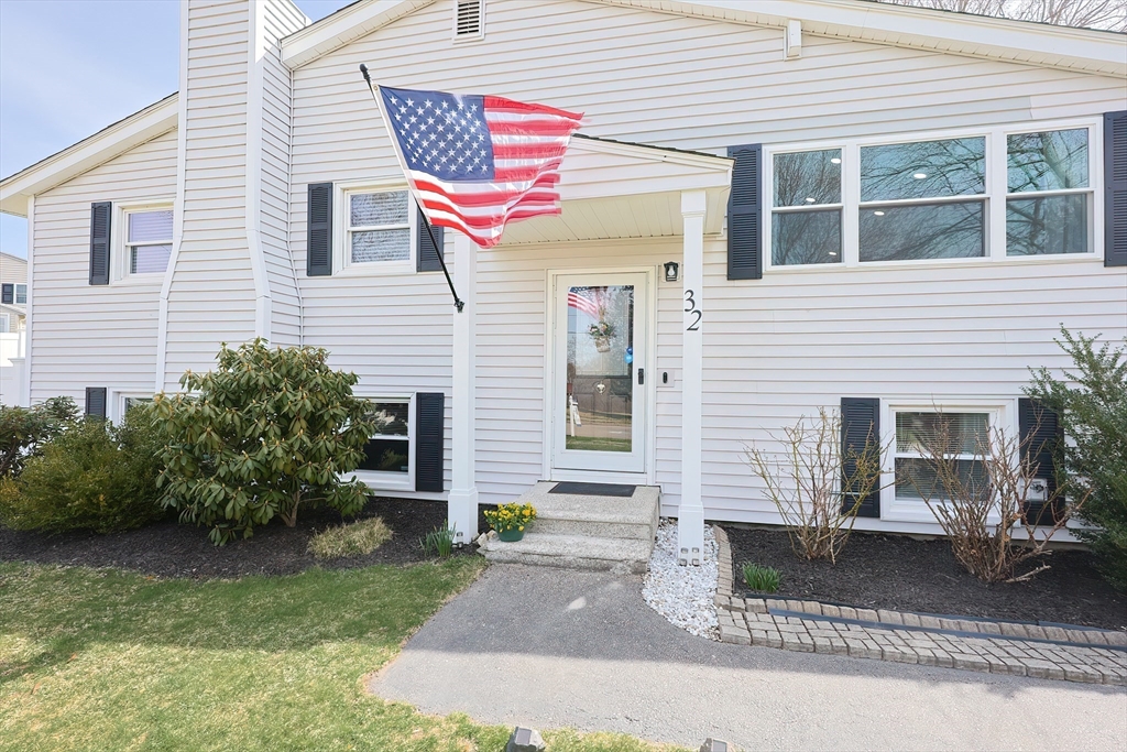 32 Anchorage Road Franklin, MA 02038 - Photo 2 of 32 a front view of a house with a yard and garage