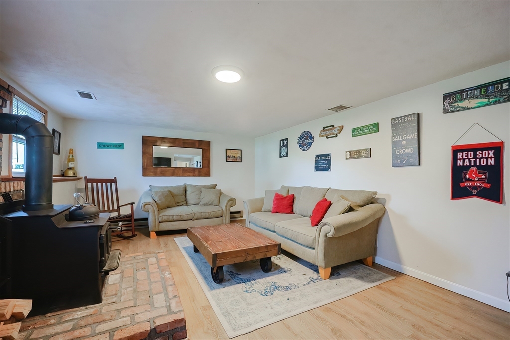 32 Anchorage Road Franklin, MA 02038 - Photo 21 of 32 a living room with furniture and wooden floor