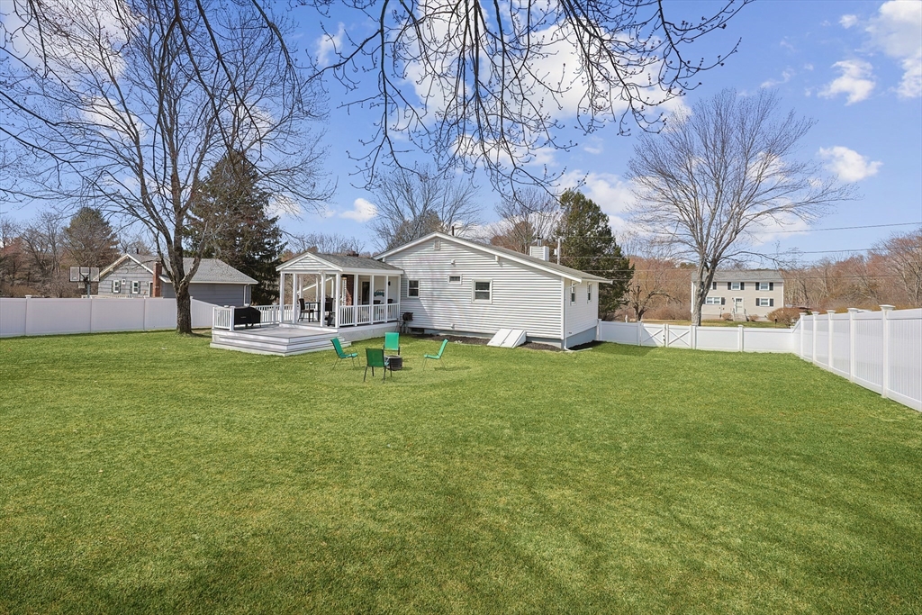 32 Anchorage Road Franklin, MA 02038 - Photo 28 of 32 a view of a white house with a yard