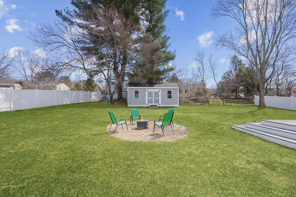32 Anchorage Road Franklin, MA 02038 - Photo 29 of 32 a backyard of a house with table and chairs