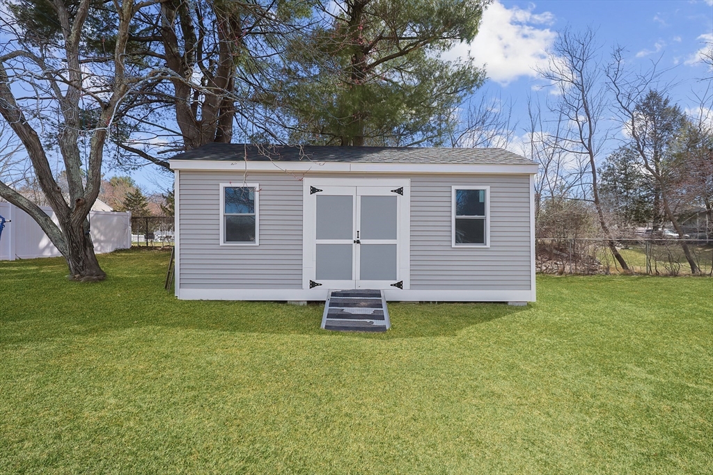 32 Anchorage Road Franklin, MA 02038 - Photo 32 of 32 a front view of a house with a garden