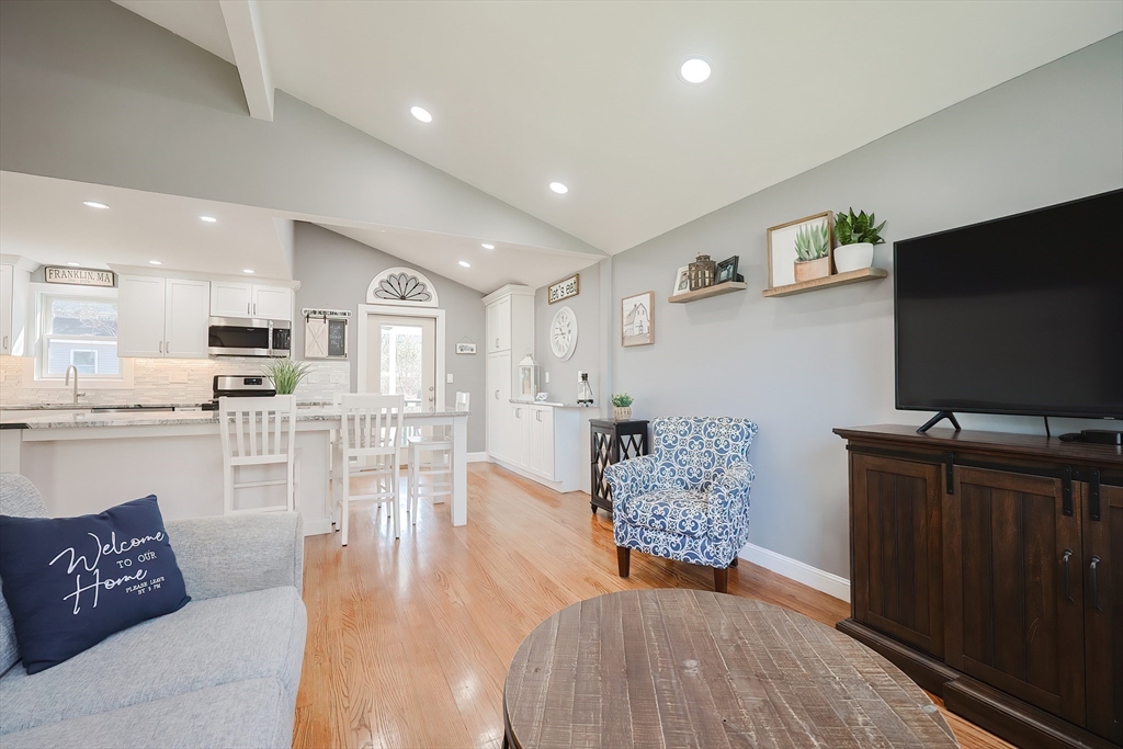 32 Anchorage Road Franklin, MA 02038 - Photo 9 of 32 a living room with furniture and a flat screen tv