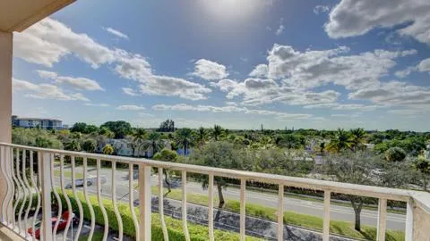 a view of a balcony with an ocean view