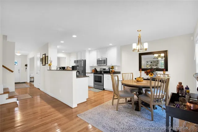 a view of kitchen with cabinets and wooden floor