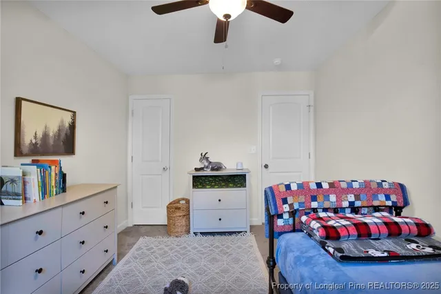 a bedroom with furniture and a dresser