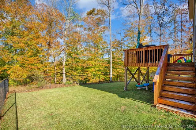 a view of a yard with basketball court