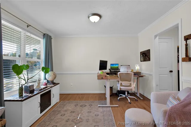 a workspace with furniture and a potted plant