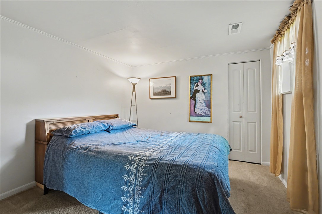 4919 Silver Arrow Drive Riverside, OH 45424 - Photo 40 of 57 This cozy bedroom offers a tranquil retreat with plush carpeting and ample natural light.