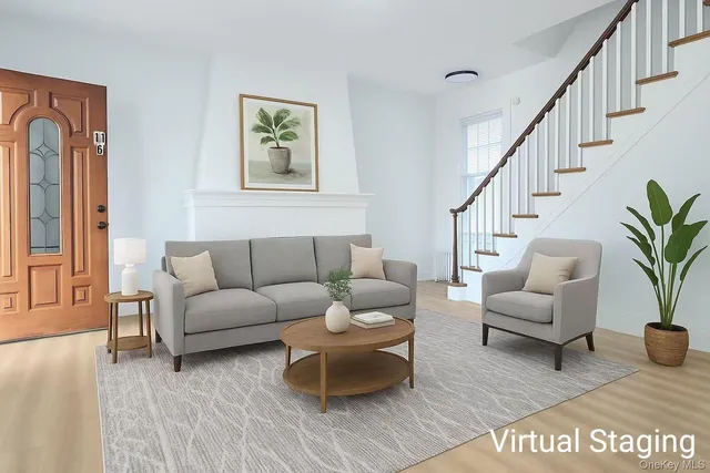 a living room with furniture potted plant and windows