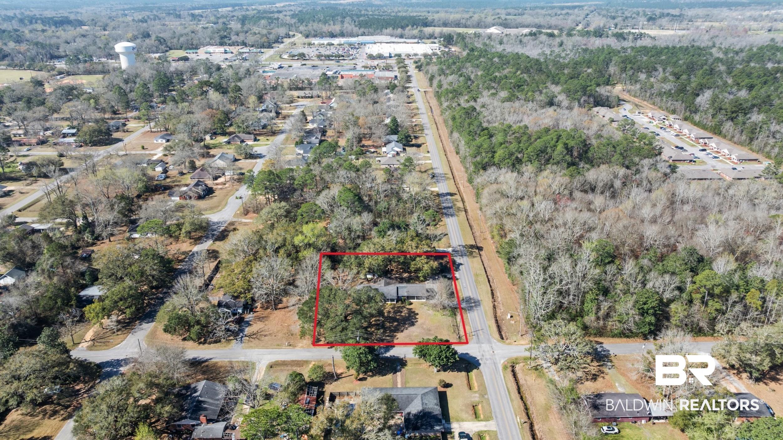 809 Moog Avenue Bay Minette, AL 36507 - Photo 33 of 33 Aerial view of property's location with property parcel outlined and a heavily wooded area