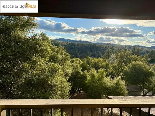 a view of a yard from a balcony