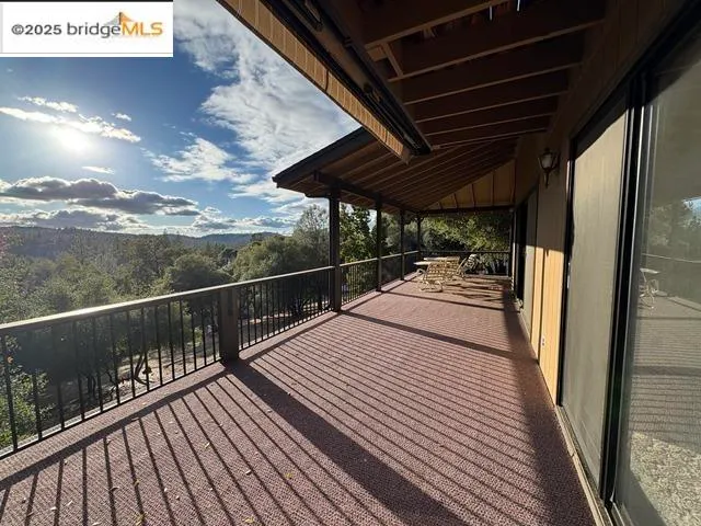 a balcony with wooden floor
