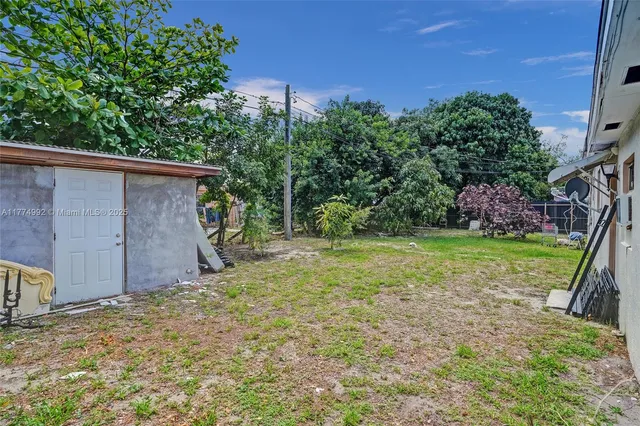 a backyard of a house with lots of green space