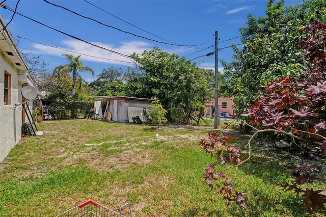 a backyard of a house with lots of green space
