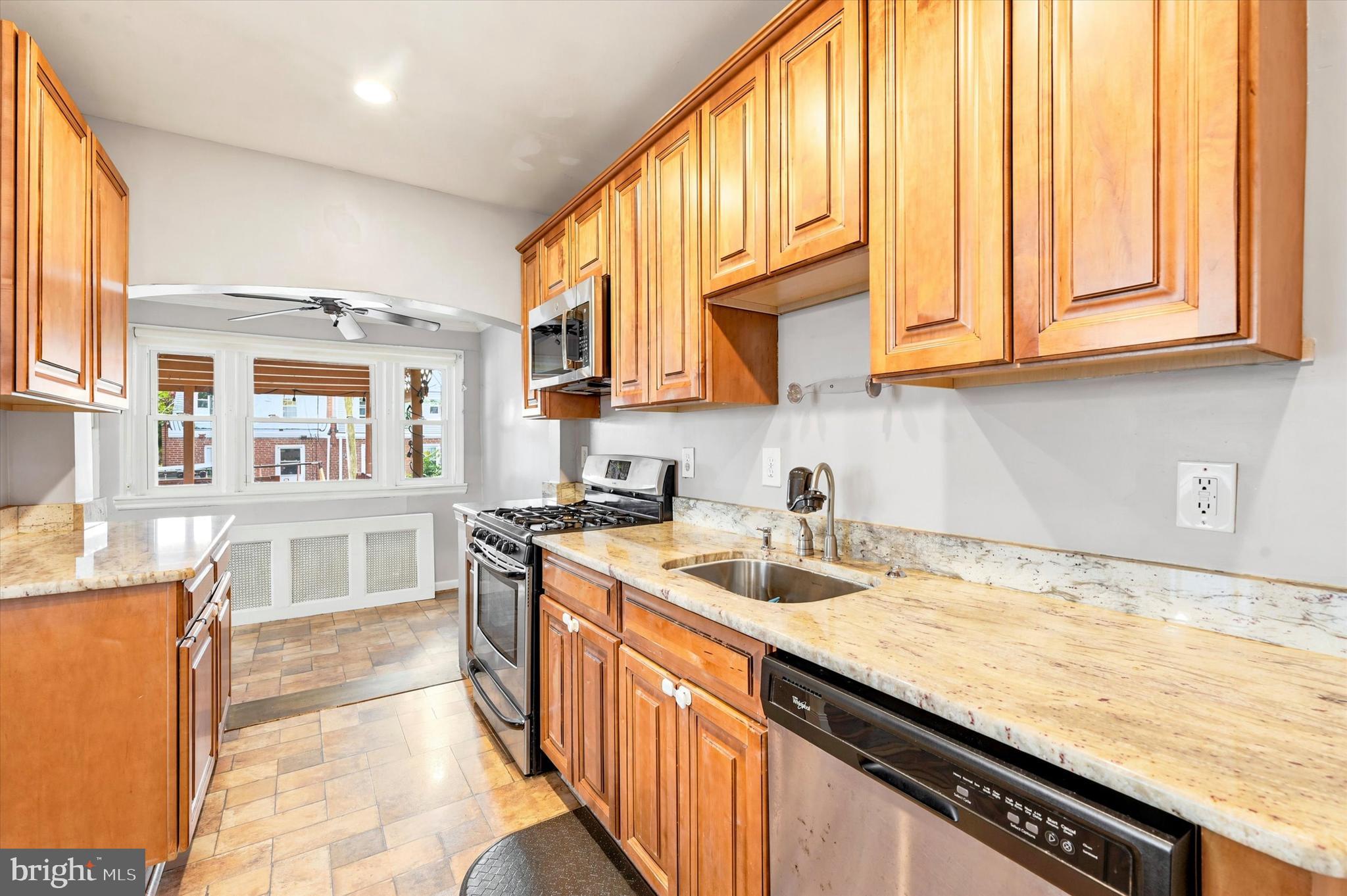1210 Harding Drive Havertown, PA 19083 - Photo 8 of 25 a kitchen with stainless steel appliances granite countertop a sink and a stove