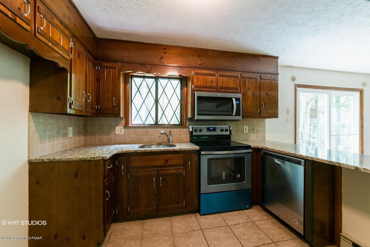 1186 Little Twig Road Effort, PA 18330 - Photo 11 of 24 a kitchen with a sink stove and microwave