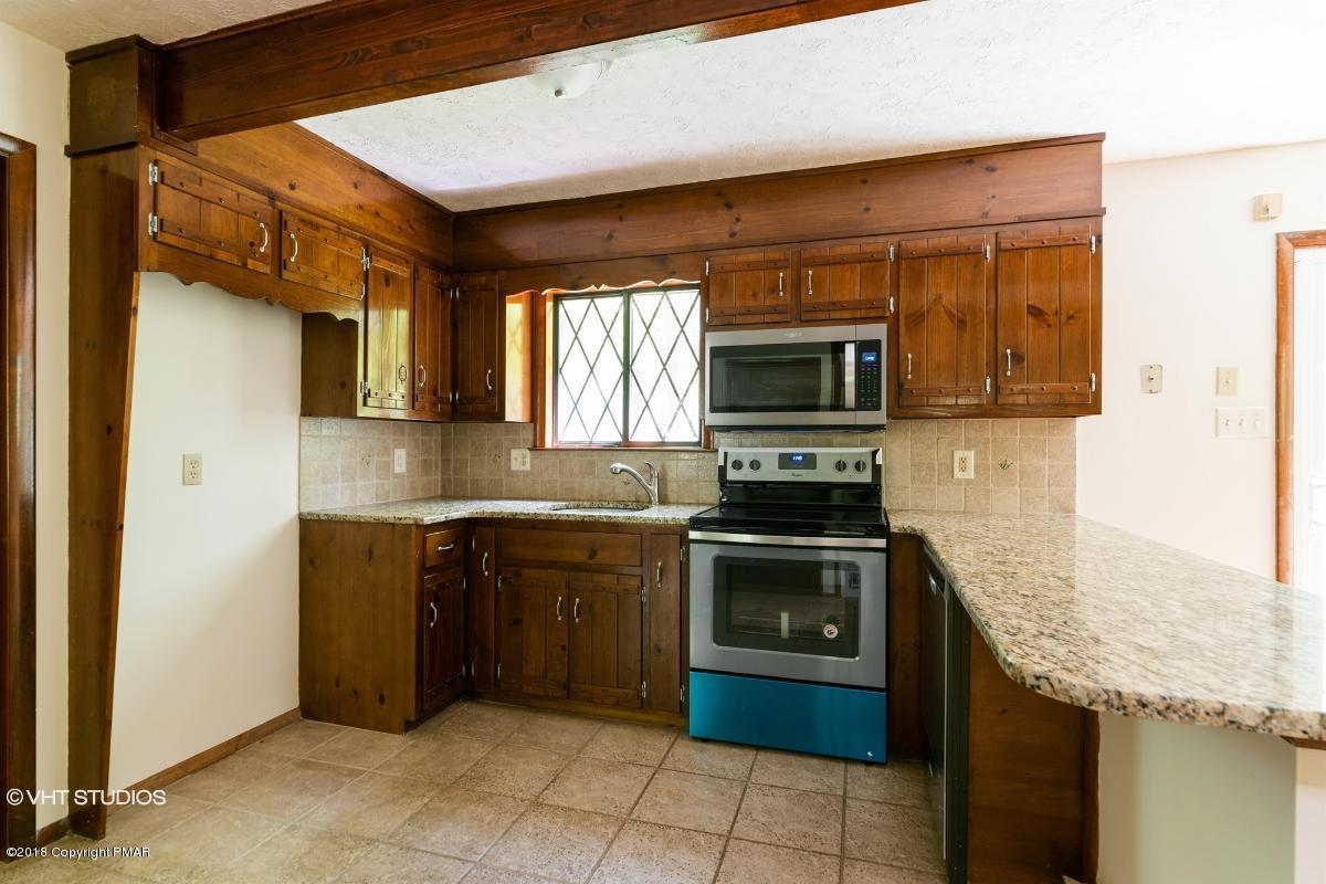 1186 Little Twig Road Effort, PA 18330 - Photo 15 of 24 a kitchen with a sink stove and microwave