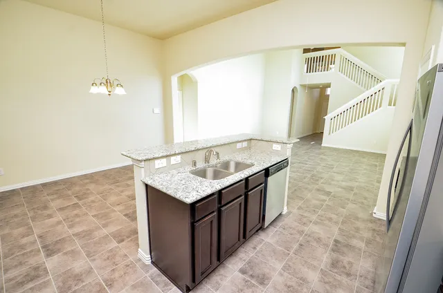 a view of a kitchen with a stove cabinets and a kitchen