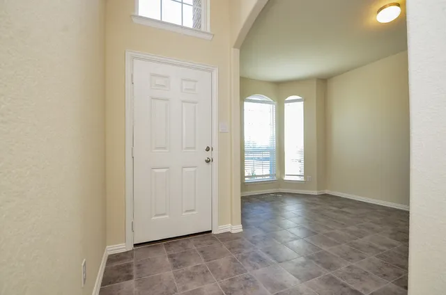 a view of an empty room and window