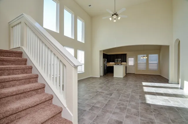 a view of staircase with white walls