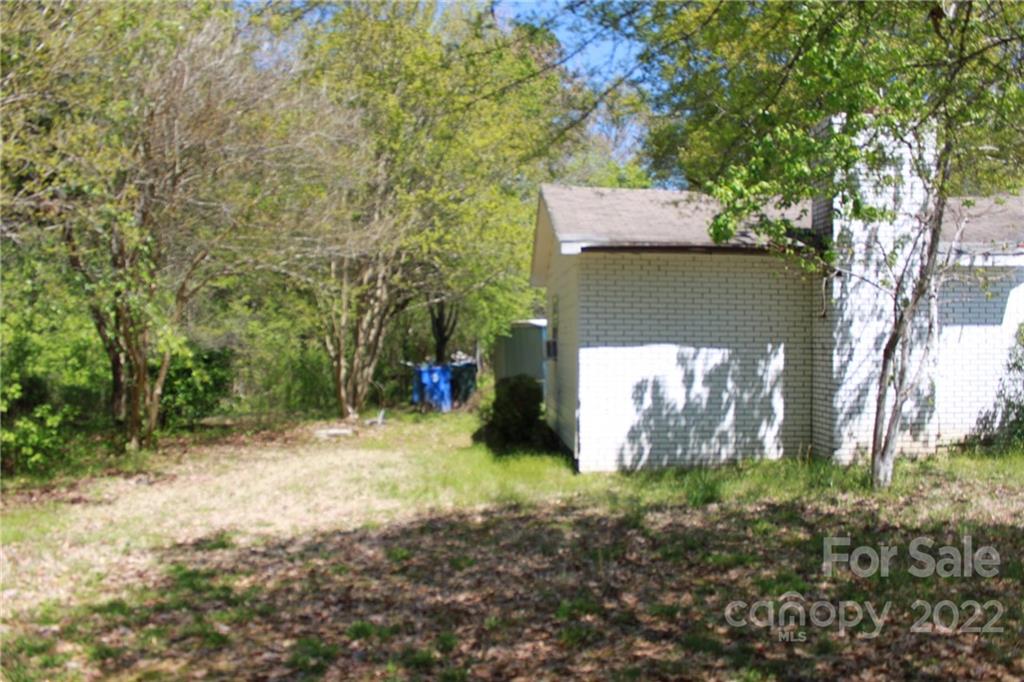 530 Edwards St Extension Rutherfordton, NC 28139 - Photo 16 of 48 a view of a yard with plants and large trees
