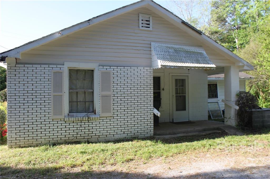 530 Edwards St Extension Rutherfordton, NC 28139 - Photo 18 of 48 a front view of a house with a garden