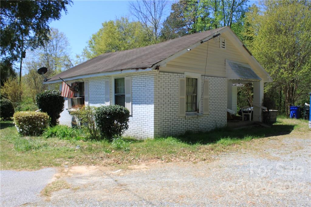 530 Edwards St Extension Rutherfordton, NC 28139 - Photo 2 of 48 a view of a house with a yard and garage