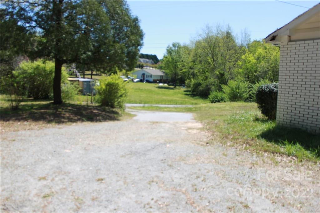 530 Edwards St Extension Rutherfordton, NC 28139 - Photo 38 of 48 a view of a yard with plants and trees