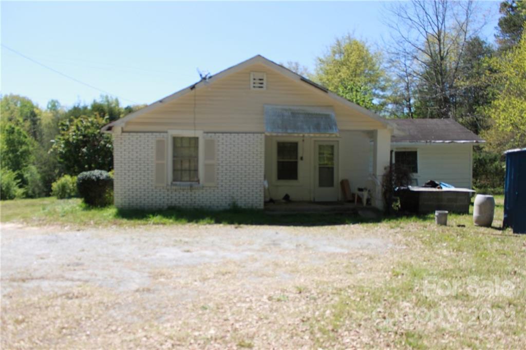 530 Edwards St Extension Rutherfordton, NC 28139 - Photo 43 of 48 a backyard of a house with wooden fence and trees